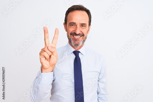 Middle age businessman wearing elegant tie standing over isolated white background showing and pointing up with fingers number two while smiling confident and happy.