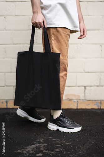Man holding cotton Black Tote bag