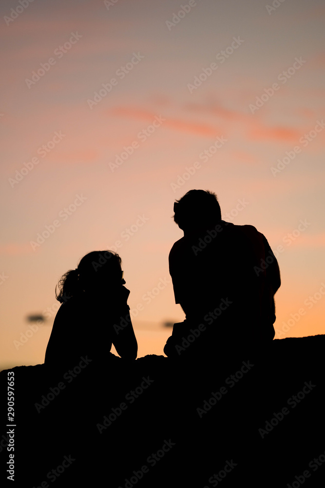 couple talking background sunset