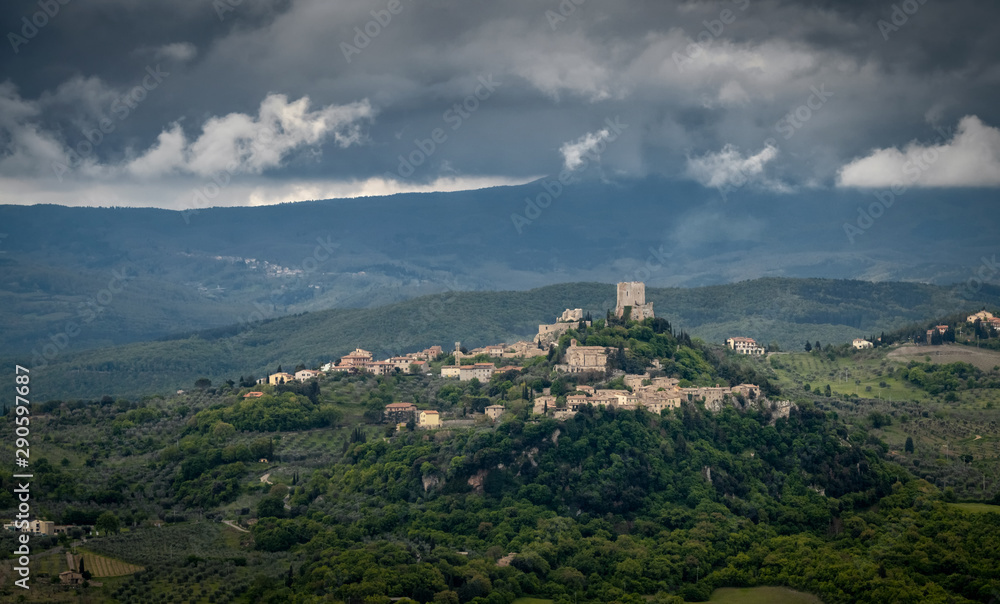 Fortress of Tentennano, Storm over small city of Castiglione d'Orcia, Italy