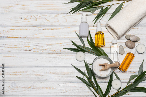 Wallpaper Mural Natural cosmetics set on wooden rustic background with copy space for your text. Creative flat lay overhead composition of natural skin care cosmetic products - cream, lotion, oils and sea salt. Torontodigital.ca