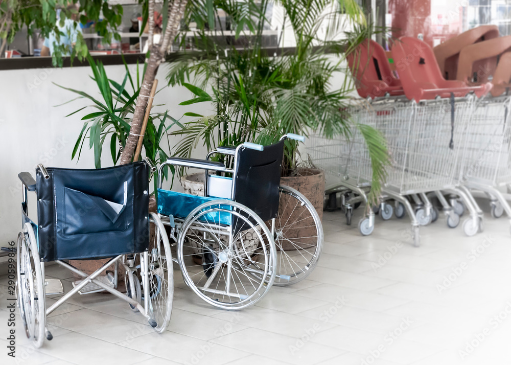 Wheelchair service point at shopping mall. Two wheelchairs waiting for disabled services at department store.