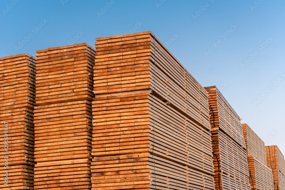 Wooden boards stacks outdoor. Lumber industry. Timber stock Wooden boards stacks outdoor. Lumber industry. Timber stock