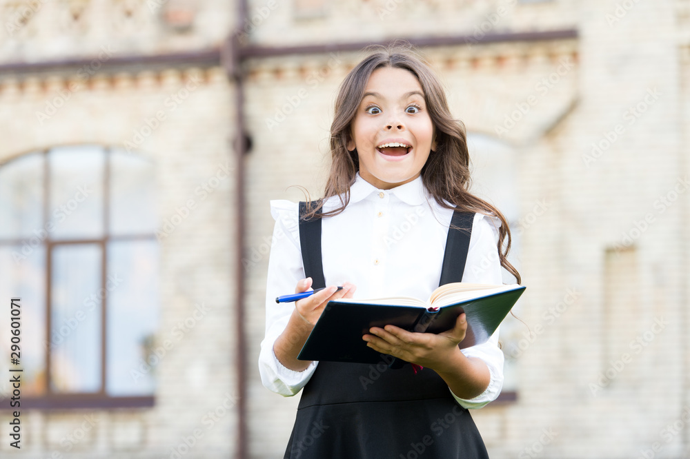 The big idea from the text. Happy little girl got main idea of book. Small cute child having genius idea from reading book. Reading for key idea and details The big idea from the text. Happy little girl got main idea of book. Small cute child having genius idea from reading book. Reading for key idea and details