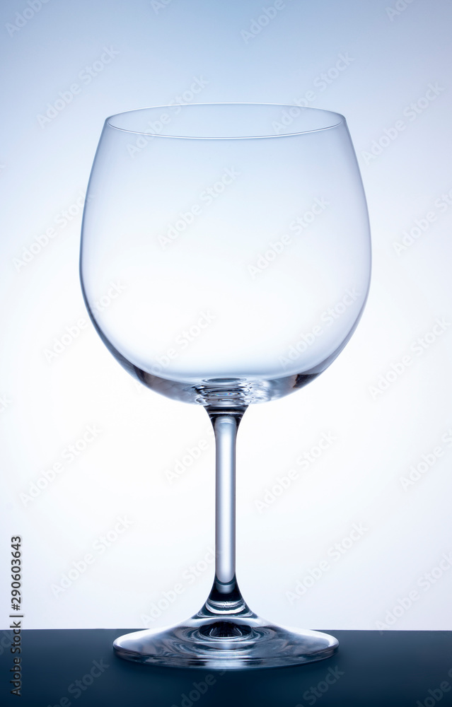 Wine glass on a white background with a light blue gradient Wine glass on a white background with a light blue gradient