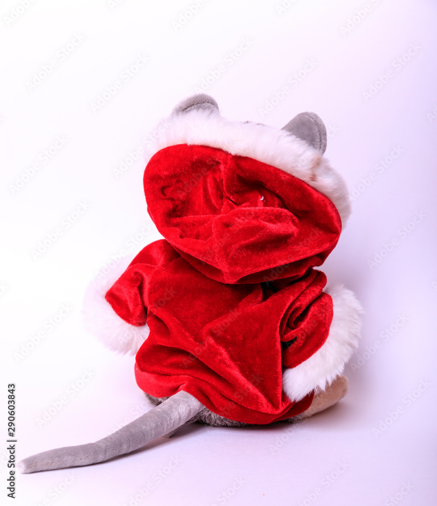 Christmas background. Xmas rat, mouse toy, symbol chinese happy new year 2020. Close up mouse toy in santa claus red hat and new year decorations. horoscope sign 2020. Copy space Christmas background. Xmas rat, mouse toy, symbol chinese happy new year 2020. Close up mouse toy in santa claus red hat and new year decorations. horoscope sign 2020. Copy space