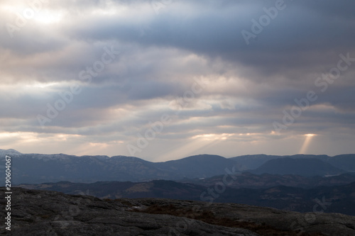 Cloudscape and light rays from mountain top © MartinAasheim
