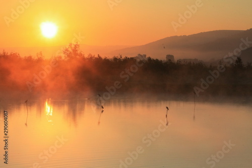 sunrise with fog on the lake