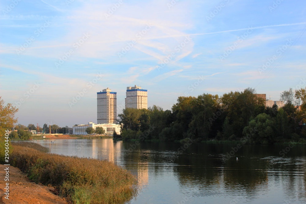 View of the river and the shore, away multi-storey buildings