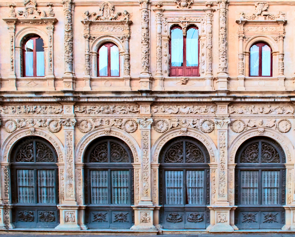 Front of arab architecture detail in the spanish city of Seville in a sunny day