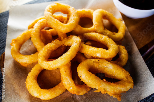Serving onion rings close-up in a bar