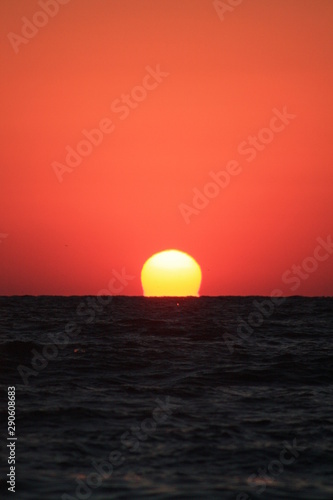 Fototapeta Naklejka Na Ścianę i Meble -  the sun comes out of the sea