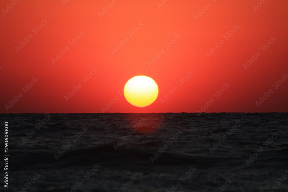 the sun rises from the sea