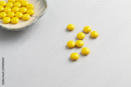 Vitamin C tablets. White background. Close up. Copy space. 