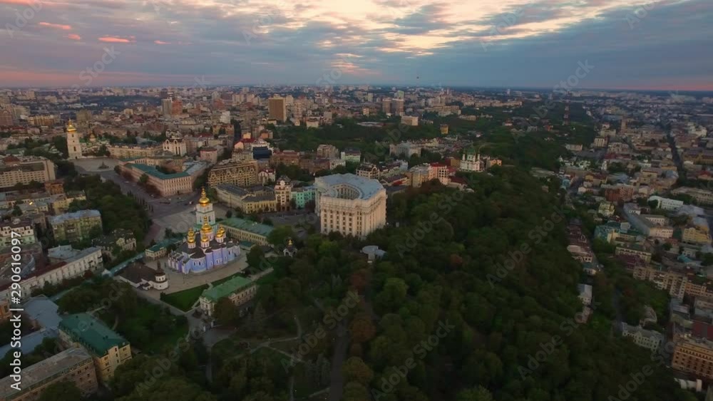 Aerial view modern city architecture on evening sunset landscape Aerial view modern city architecture on evening sunset landscape