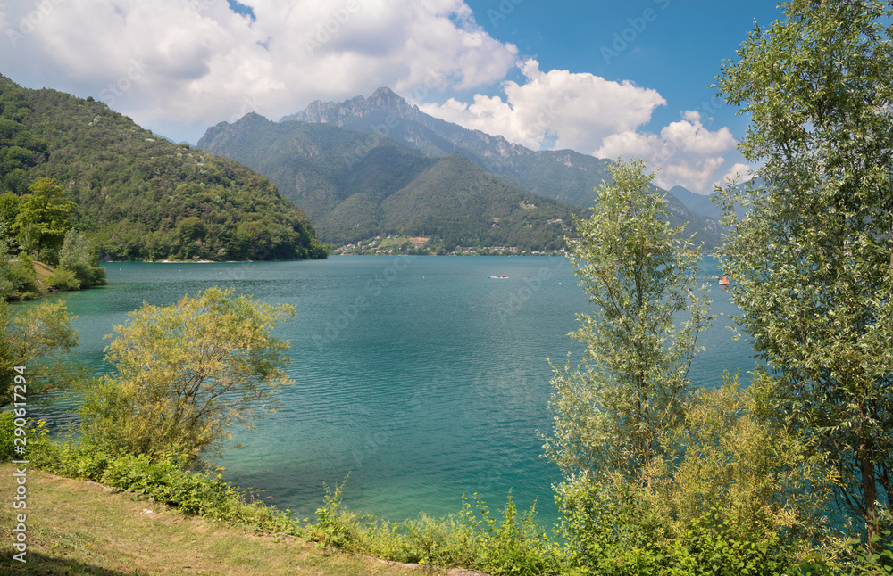 The lake Lago di Ledro among the Alps in the Trentino district .