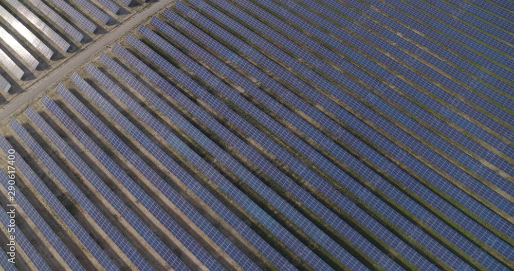 Solar panel farm Aerial view 4K. Alternative Renewable sun energy power plant. Solar panel farm Aerial view 4K. Alternative Renewable sun energy power plant.