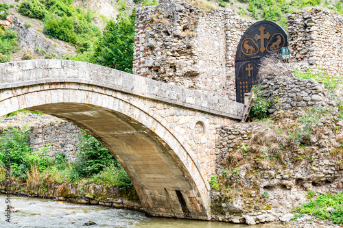 Lumbardhi  Kosovo - July 28  2019. Old bridge and gate to Monastery of the Holy Archangels