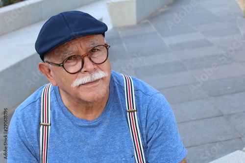 Stylish senior Hispanic man outdoors