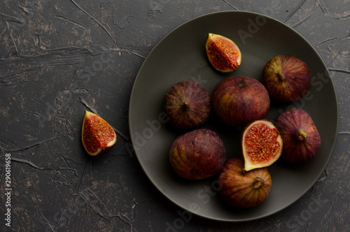 figs in a black platel on the dark gray background photo