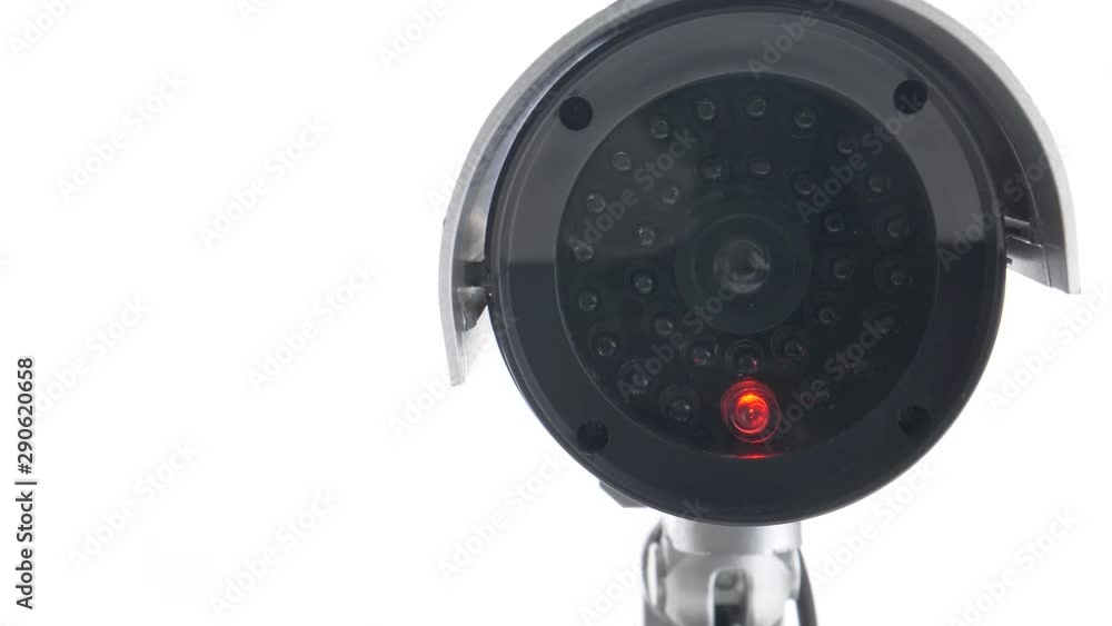 Security video camera moving to scan the area for surveillance purposes. Robotic CCTV recording technology. Security video camera moving to scan the area for surveillance purposes. Robotic CCTV recording technology.