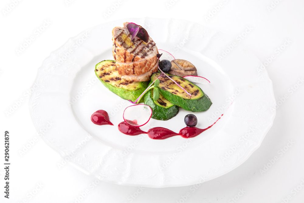 Meat roll with grilled vegetables. Banquet festive dishes. Fine dining restaurant menu. White background.