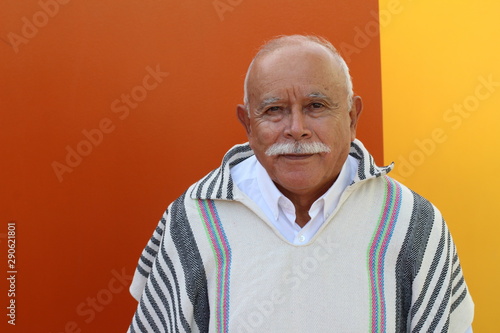 Legit Hispanic senior man wearing a ruana  photo