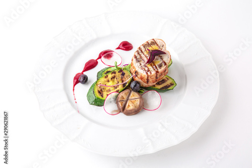 Meat roll with grilled vegetables. Banquet festive dishes. Fine dining restaurant menu. White background.