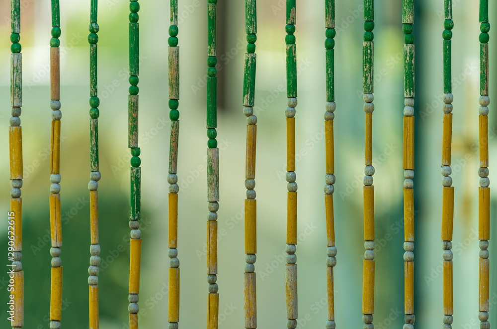 Selective focus close up of hanging wooden bead strings Selective focus close up of hanging wooden bead strings