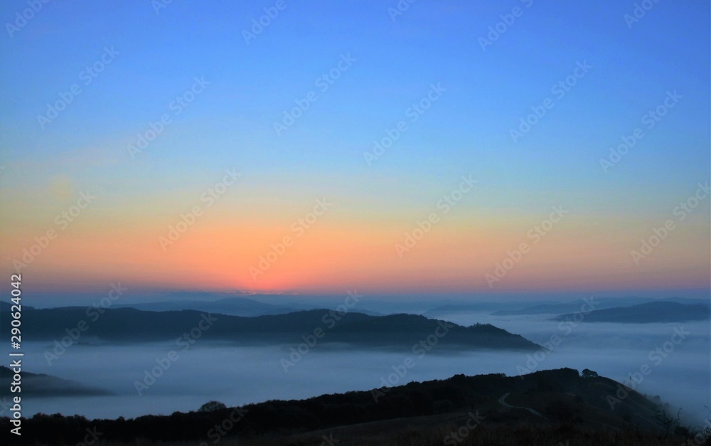 sunrise over mountains with fog in the valley sunrise over mountains with fog in the valley