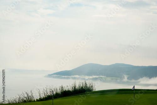 Foggy day by the St-Laurent river, golf field 