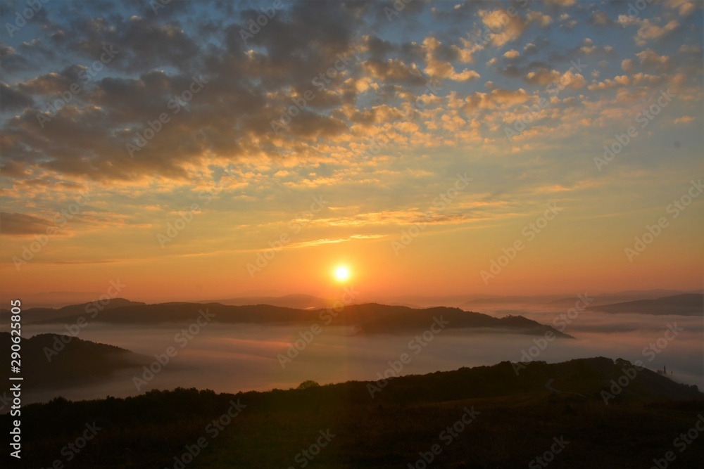 sunrise over mountains with fog in the valley sunrise over mountains with fog in the valley