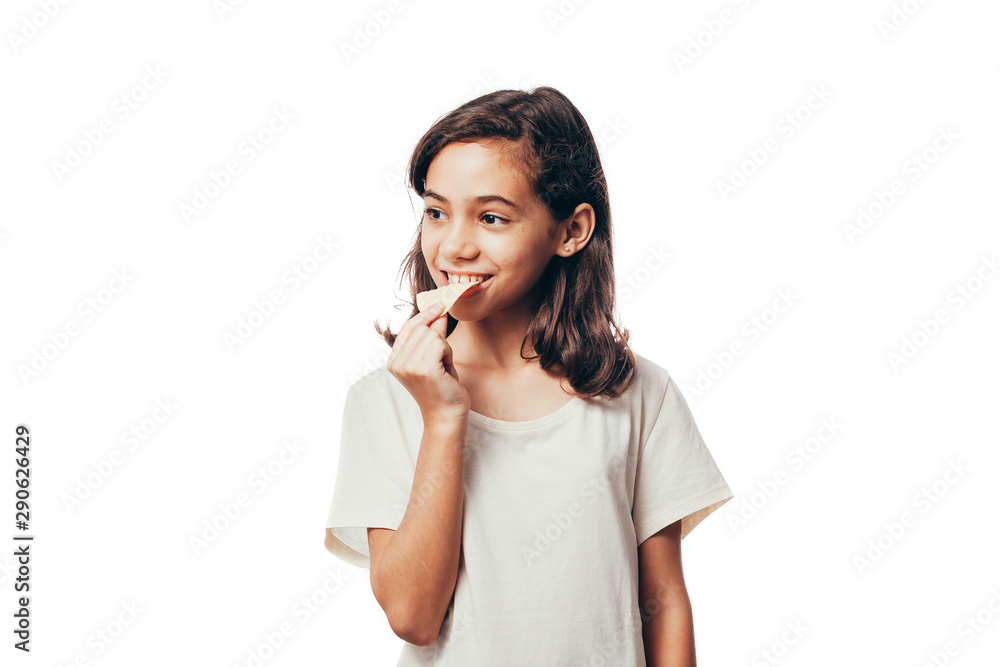 Teenage girl eating potato chips isolated on white background Teenage girl eating potato chips isolated on white background