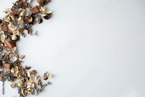 Flowers composition. Frame made of dried rose flowers on white background. Flat lay, top view, copy space