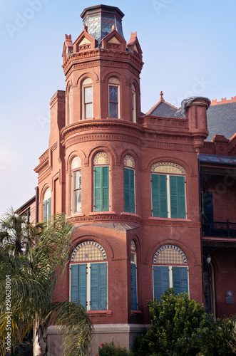 Vertical: Historic Queen Anne style red brick house on Galveston Island, Texas.