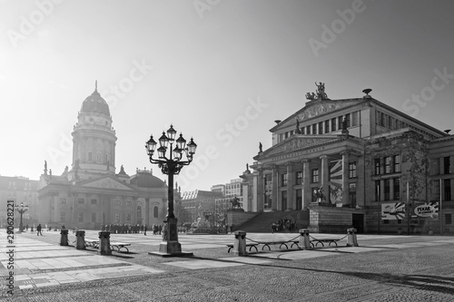 BERLIN, GERMANY, FEBRUARY - 14, 2017: The Konzerthaus building and the memorial of Friedrich Schiller and German dom on the Gendarmenmarkt square. photo