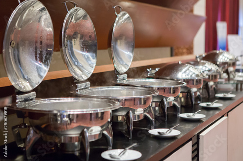Chafing dishes on the table at the  luxury banquet