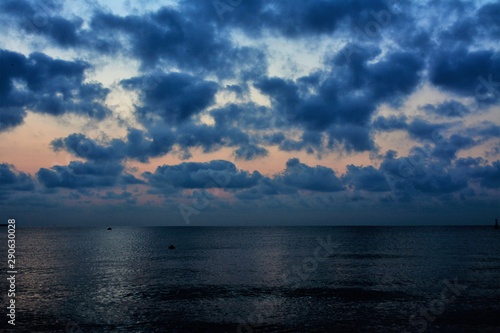 sunrise among the clouds at sea © sebi_2569
