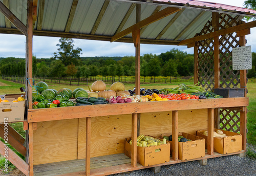 Self serve farm stand with fresh  fruit and vegetables in rural countryside