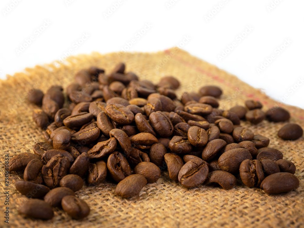 Coffee beans , brown sackcloth background. Coffee beans , brown sackcloth background.