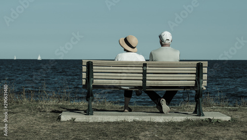 senior couple sitting on a bench