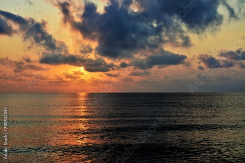 clouds over the ocean in the evening