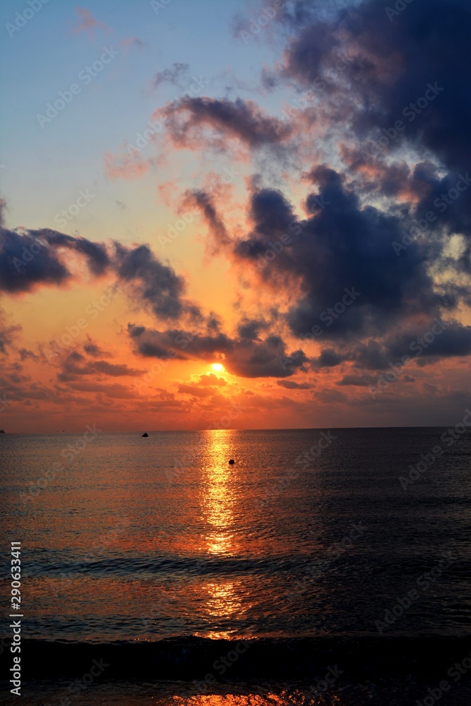 a sunrise with sunbeams among the clouds at sea a sunrise with sunbeams among the clouds at sea