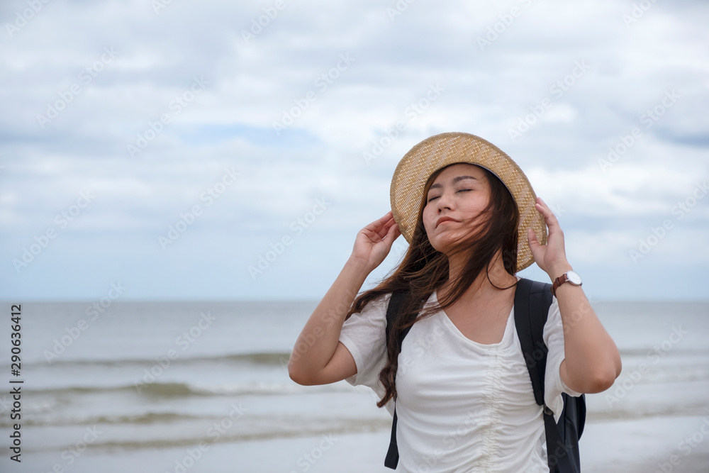 A sad woman standing alone by the sea A sad woman standing alone by the sea
