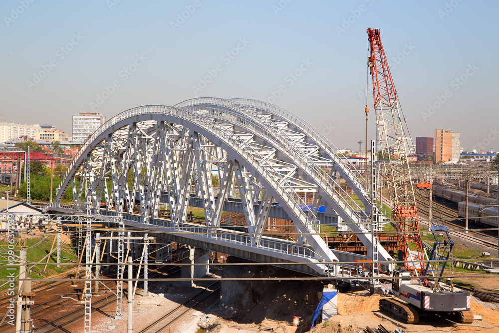 Fototapeta premium Under construction railway bridge over the railway tracks.Horizontally.Vertically.