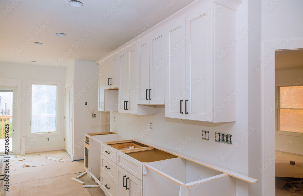 Picture of Custom kitchen cabinets in various stages of installation base Stock ...