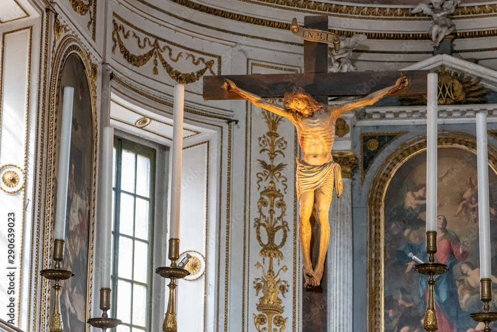 Realistic sculpture of Jesus on the cross decorating interior of