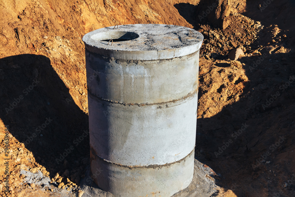 Concrete well at the construction site for water pipes and sewage Concrete well at the construction site for water pipes and sewage