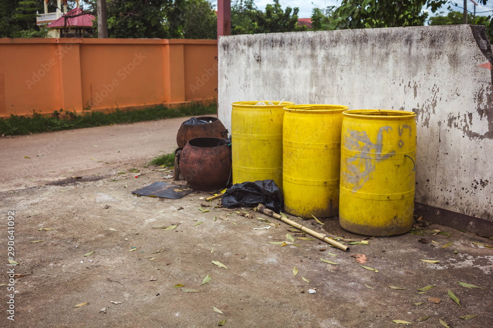 Old yellow trash empty on the wall Old yellow trash empty on the wall