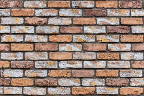 Closed up orange brick wall texture. Architectural material construction.